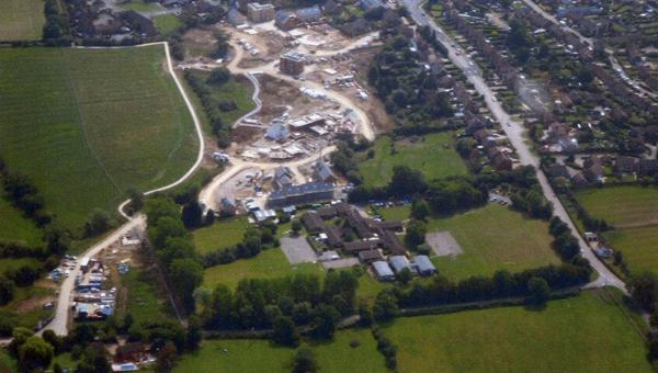 Aerial view showing school and houses